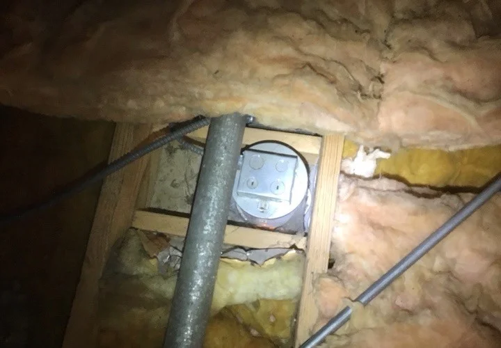 Recessed light fixture that is not IC-rated, in contact with attic insulation