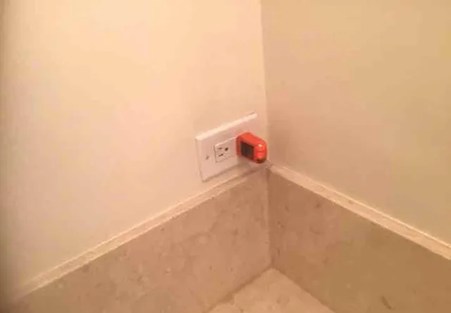 Bathroom outlet without GFCI protection: photo 1 from a Chicago inspection report