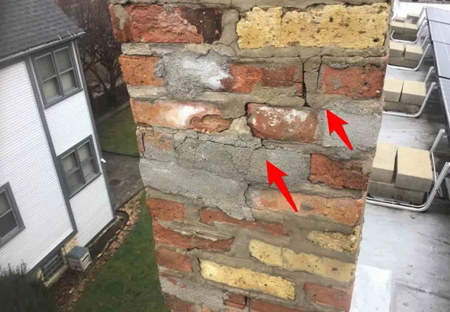 Cracked chimney brick and caps: photo 1 from a Chicago inspection report