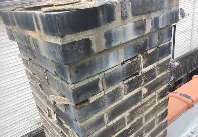 Chimney badly deteriorated: photo 2 from a Chicago inspection report