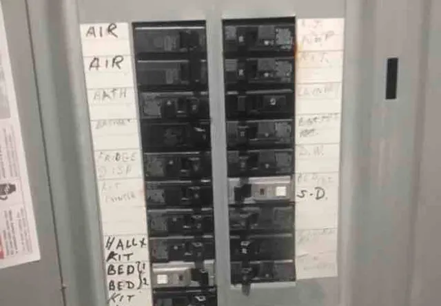 Mixed breaker brands in the panel: photo 1 from a Chicago inspection report