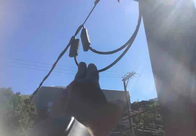 Power lines too close to the rear deck: photo 1 from a Chicago inspection report