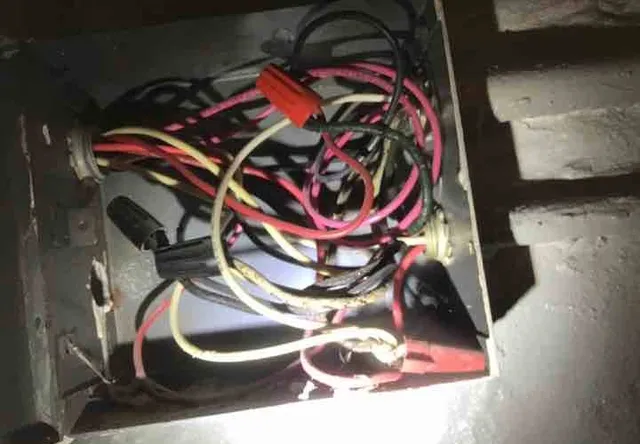 Old cloth-insulated wiring in the panel: photo 1 from a Chicago inspection report