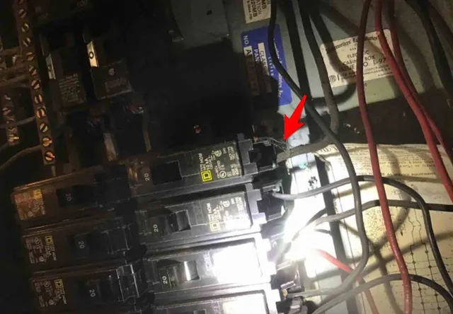 Old cloth-insulated wiring in the panel: photo 2 from a Chicago inspection report
