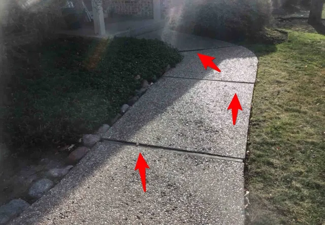 Cracked, uneven walkways (trip hazard): photo 2 from a Chicago inspection report