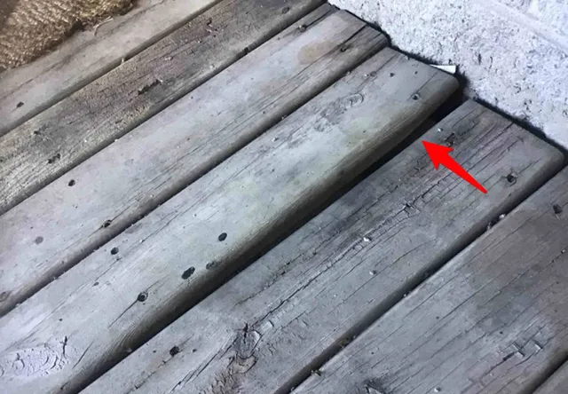 Rotting deck with loose boards and railings: photo 1 from a Chicago inspection report