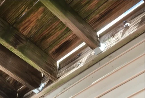 Deteriorated framing under a rear wood balcony (photo 2)