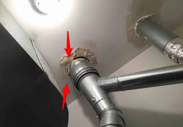 Furnace vent touching drywall (fire risk): photo 2 from a Chicago inspection report