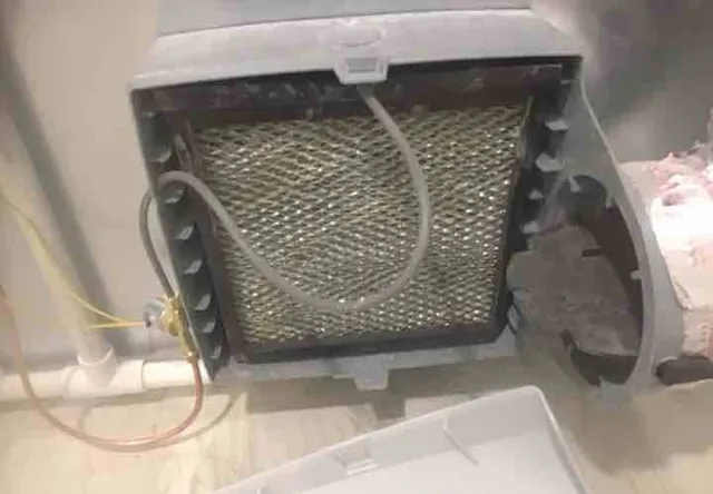 Humidifier scaled up, needs service: photo 1 from a Chicago inspection report