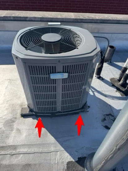 AC condenser sitting directly on the roofing with no pad