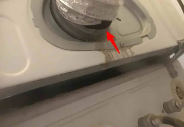 Dryer duct disconnected behind the dryer: photo 1 from a Chicago inspection report