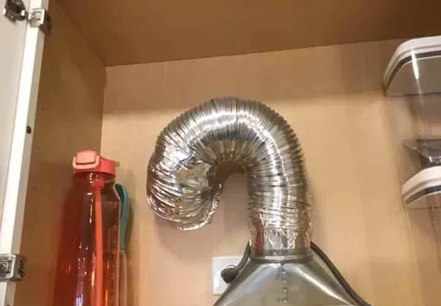 Flexible range hood duct (grease fire risk): photo 1 from a Chicago inspection report