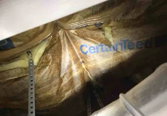 Flammable insulation wrap next to the furnace: photo 1 from a Chicago inspection report