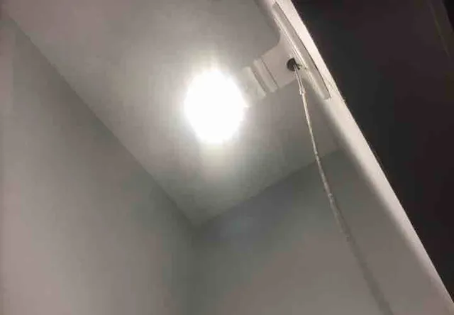 Bare bulbs in the closets: photo 1 from a Chicago inspection report
