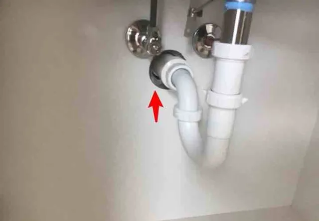 Missing cover plates under the sinks: photo 1 from a Chicago inspection report