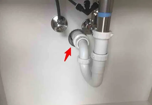 Missing cover plates under the sinks: photo 2 from a Chicago inspection report