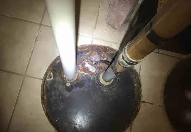 Damaged, unsealed ejector pit cover: photo 1 from a Chicago inspection report