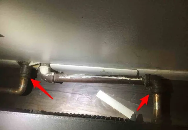 New copper tied into old galvanized without the right fitting: photo 2 from a Chicago inspection report