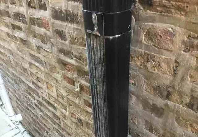 Leaking downspouts: photo 1 from a Chicago inspection report